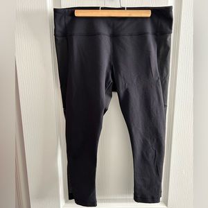 Lululemon cropped black leggings with mesh on back calf area.